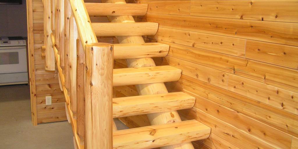 Full log stringers coped to fit a 10 inch half log tread standard length of tread is 48 inches.