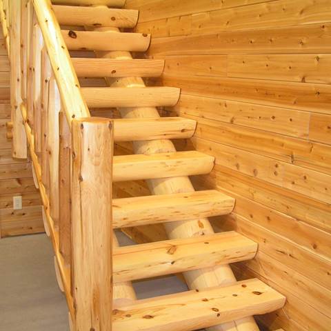 Full log stringers coped to fit a 10 inch half log tread standard length of tread is 48 inches.