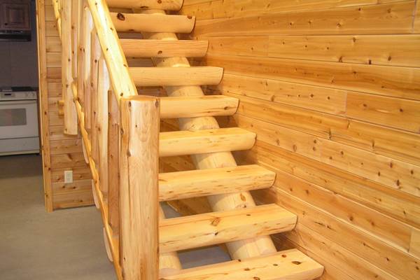 Full log stringers coped to fit a 10 inch half log tread standard length of tread is 48 inches.