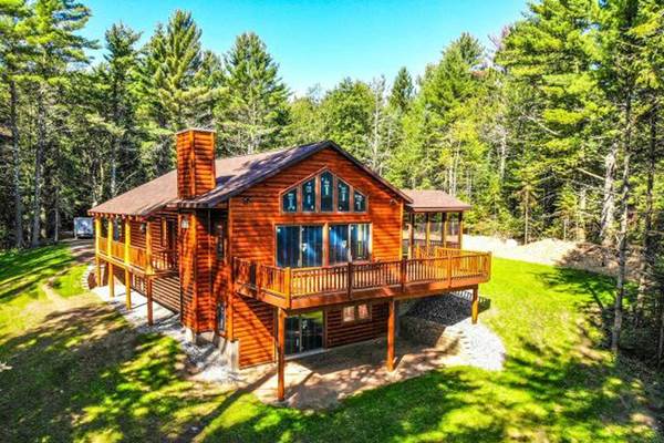 Log home built with 2x8 log siding with a butternut pre-finish stain.