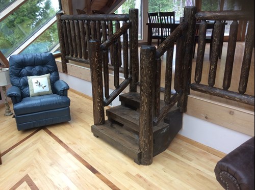 Hand hewn cedar log rustic railing.