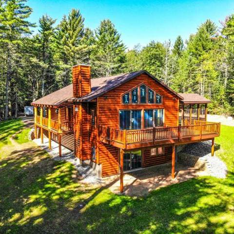 Log home built with 2x8 log siding with a butternut pre-finish stain.