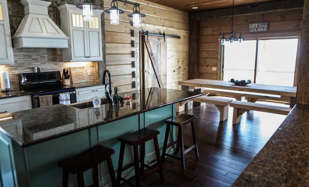 a log cabin kitchen with modern accents