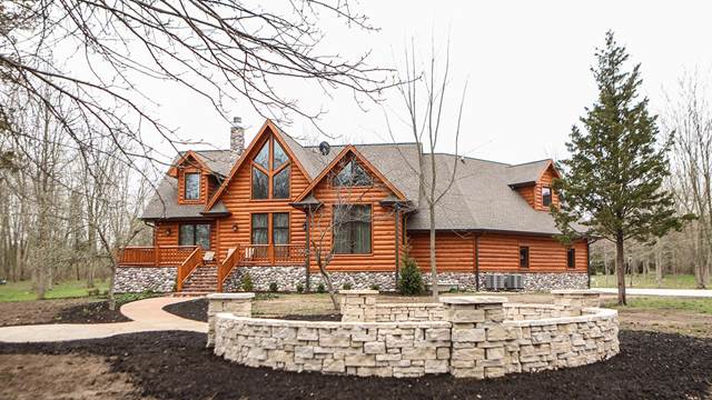 House with 3X10 Cedar Hand Hewn Log Siding