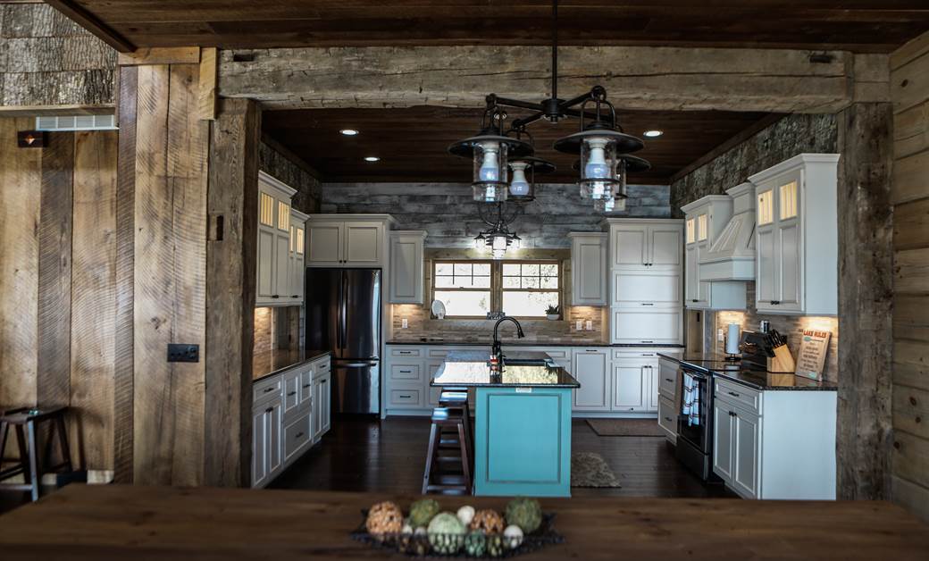 a modern lake house kitchen with rustic barn wood siding and cabin kitchen cabinets