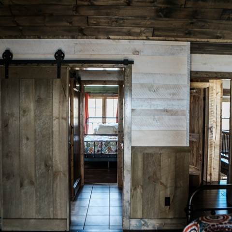 shiplap vs nickel gap, example of home with whitewashed shiplap installed from Northern Log Supply