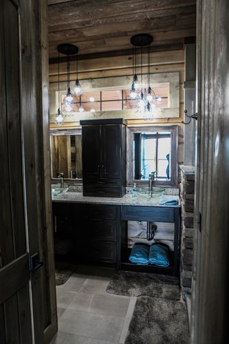 Lake house bathroom countertop with barn wood siding.