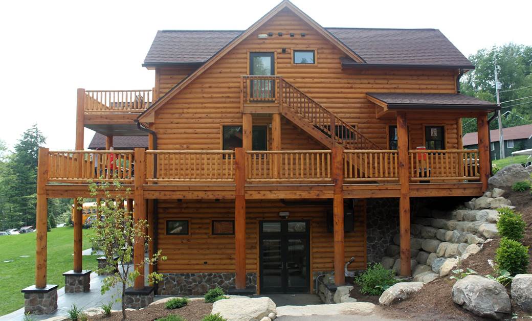 Camp Walden Exterior with 3X8 Pine Hand Hewn Sikkens Cedar Vertical & Inside Corners Classic Railing
