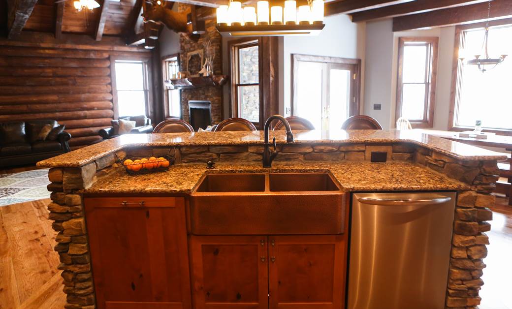 a stone kitchen island in an open concept home