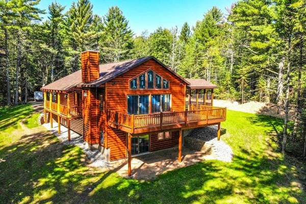 Log home built with 2x8 log siding with a butternut pre-finish stain.