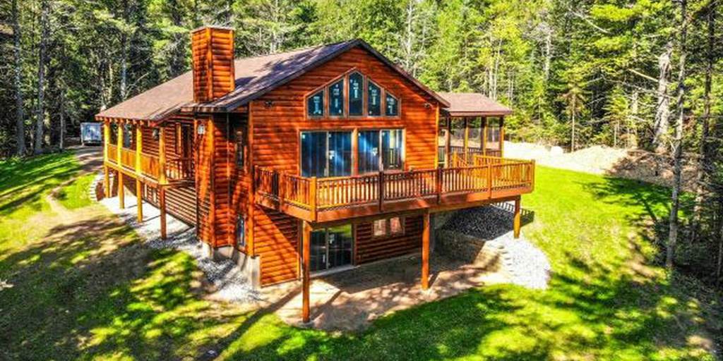 Log home built with 2x8 log siding with a butternut pre-finish stain.
