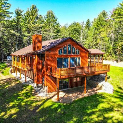 Log home built with 2x8 log siding with a butternut pre-finish stain.