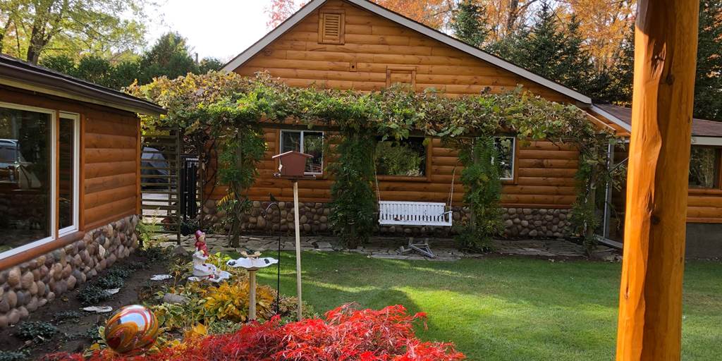 A properly maintained exterior of a log house