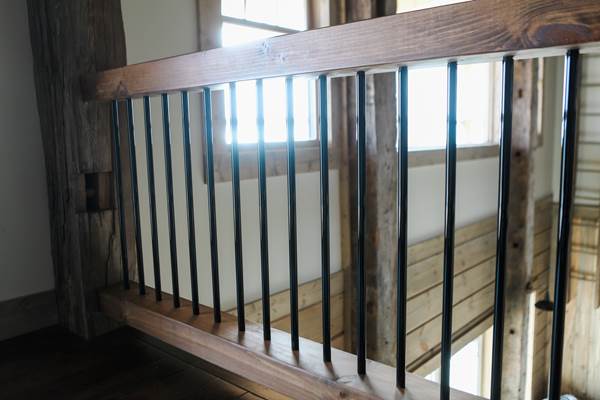 Close up of black bar railing.
