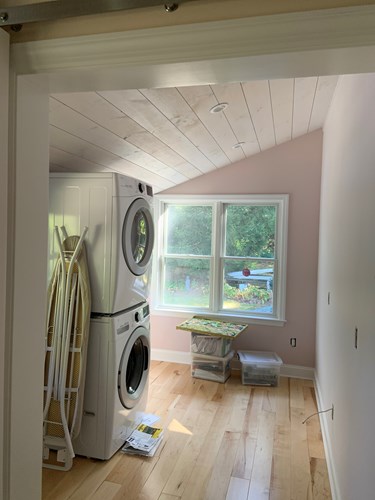 1x8 whitewash nickel gap in laundry room.