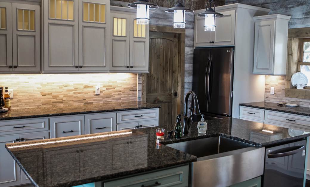 colorful cabinets in a modern log home kitchen