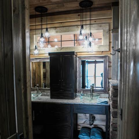 Lake house bathroom countertop with barn wood siding.